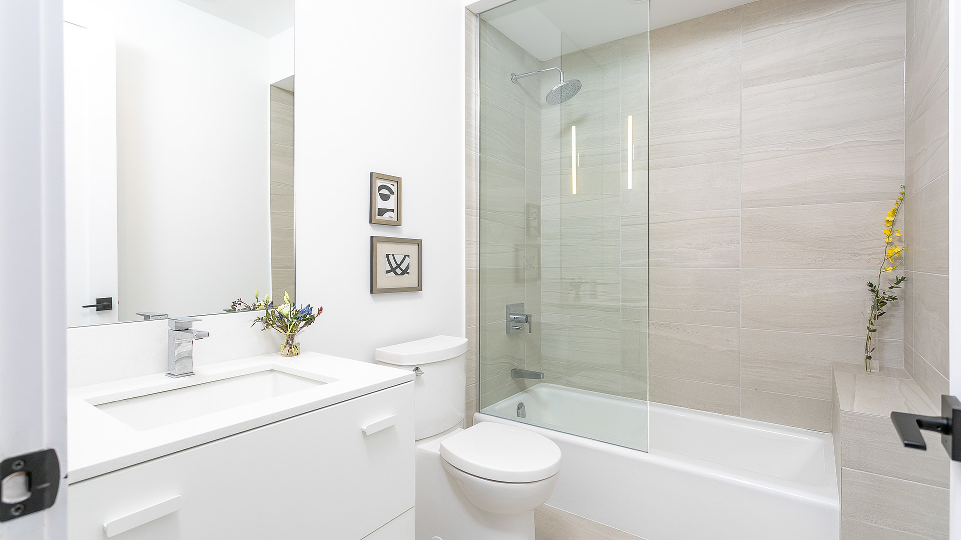 Modern bathroom with glass shower and porcelain tile