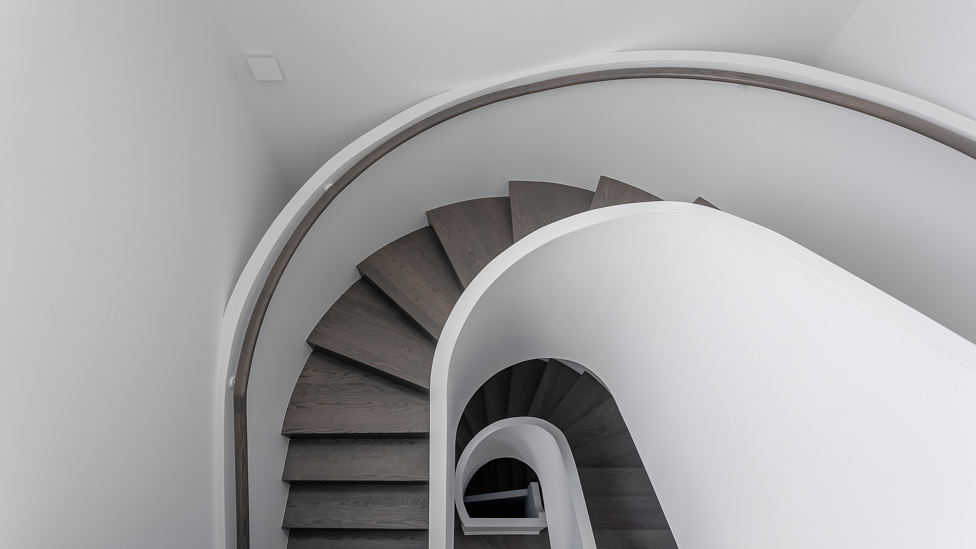 Custom spiral staircase with oak treads viewed from above